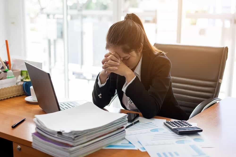 Woman at Desk - Mental Health - Meadowglade|Group Session - Mental Health - Meadowglade