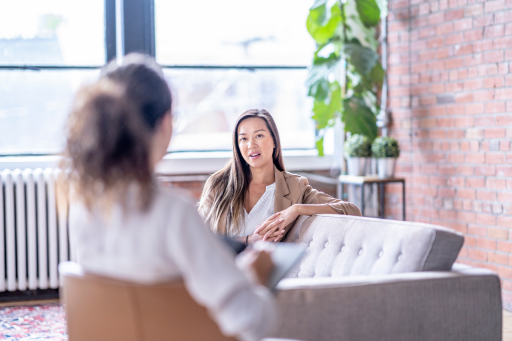 woman speaking with her therapist about the differences of a Psych Ward vs Mental Hospital