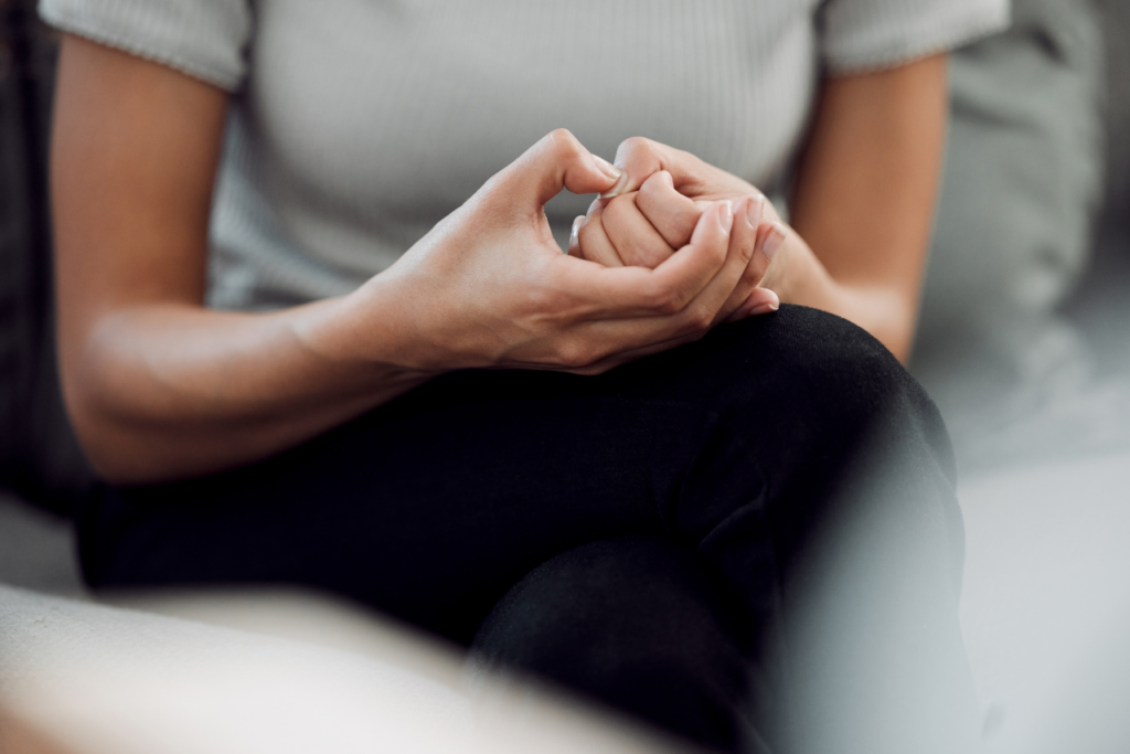 woman sitting in a chair struggling with Anxiety Disorder in the Workplace