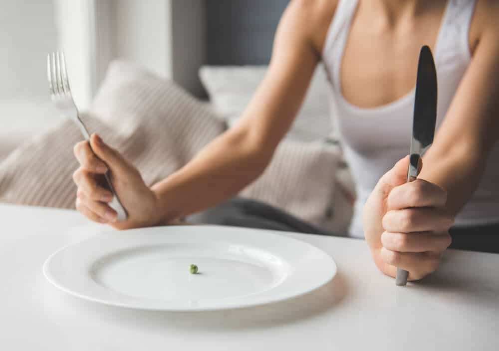 Plate – Adult Eating Disorder – The Meadowglade|Sad Woman – Stress Disorder – The Meadowglade|