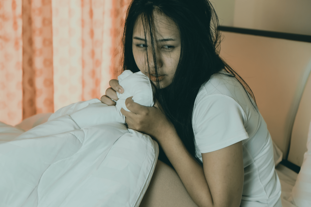 woman struggling with Undifferentiated schizophrenia|||book with the text showing Undifferentiated schizophrenia