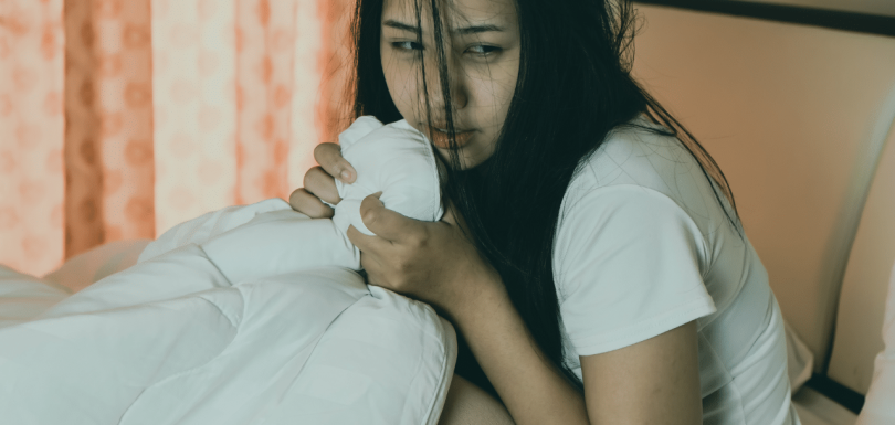 woman struggling with Undifferentiated schizophrenia|||book with the text showing Undifferentiated schizophrenia