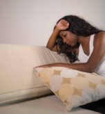 Young,Attractive,And,Sad,Black,African,American,Woman,Sitting,Depressed
