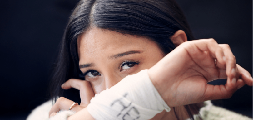woman struggling with cutting wondering why do people cut themselves|patient speaking to his therapist about why do people cut themselves|woman sitting on the floor in the dark wondering why do people cut themselves