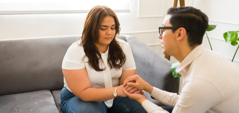 man helping woman with anxiety