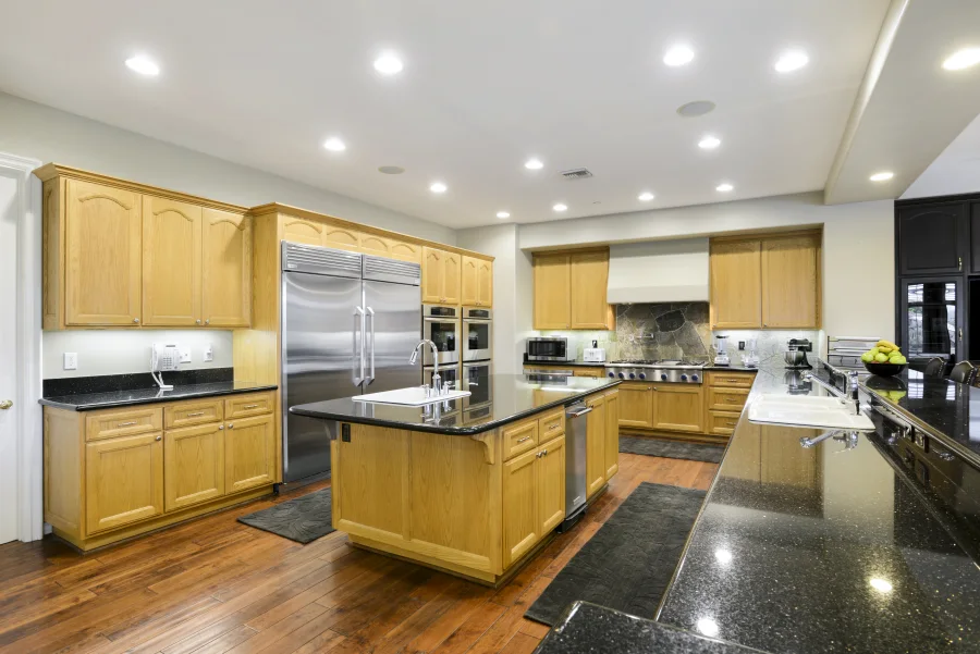 Full kitchen and central island in The Meadowglade main house, part of optional supportive housing