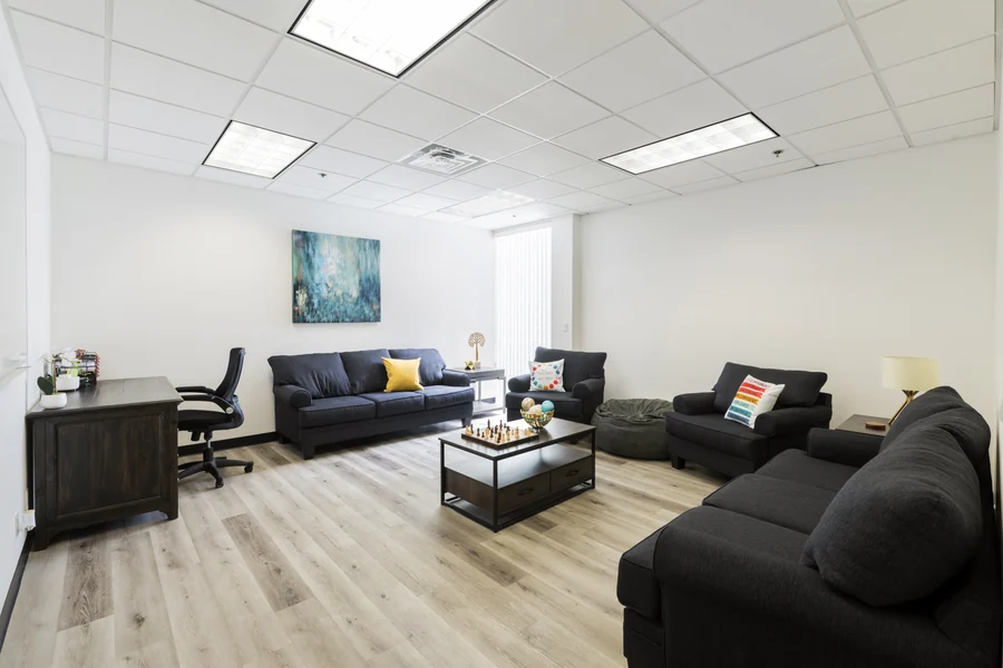 Bright lounge with sofas at The Meadowglade outpatient clinic